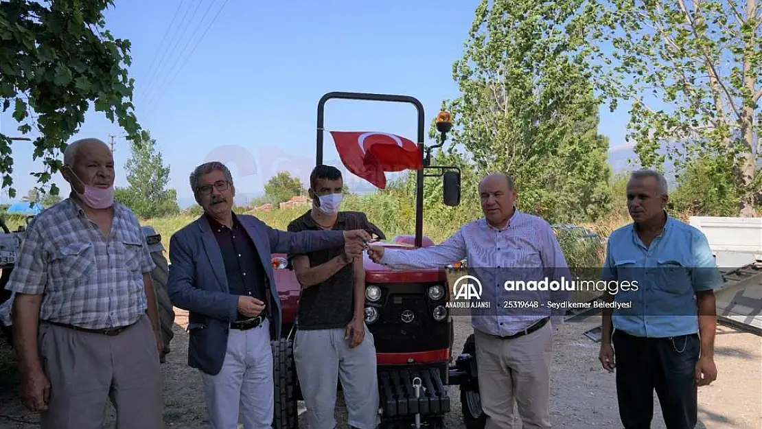 Muğla'da orman yangınına müdahale eden çiftçinin hasar gören traktörünün yerine yenisi alındı