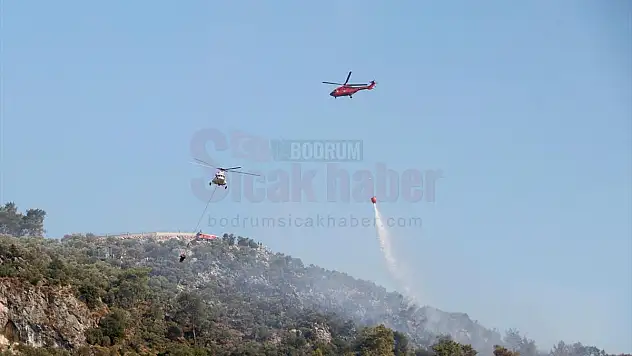 Dalaman Havalimanı yakınlarında çıkan orman yangını kontrol altına alındı
