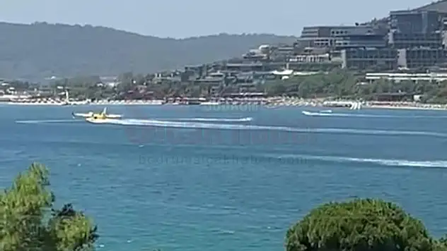 Jet skiye çarpmamak için deniz üstünde duran yangın söndürme uçağı kameraya yansıdı