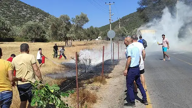 Yalıçiftlik'de elektrik direğinden çıkan yangını gönüllü vatandaşlar söndürdü