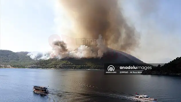 Marmaris'te çıkan orman yangınına 6 helikopter, 14 arazöz ve 135 işçiyle müdahale ediliyor